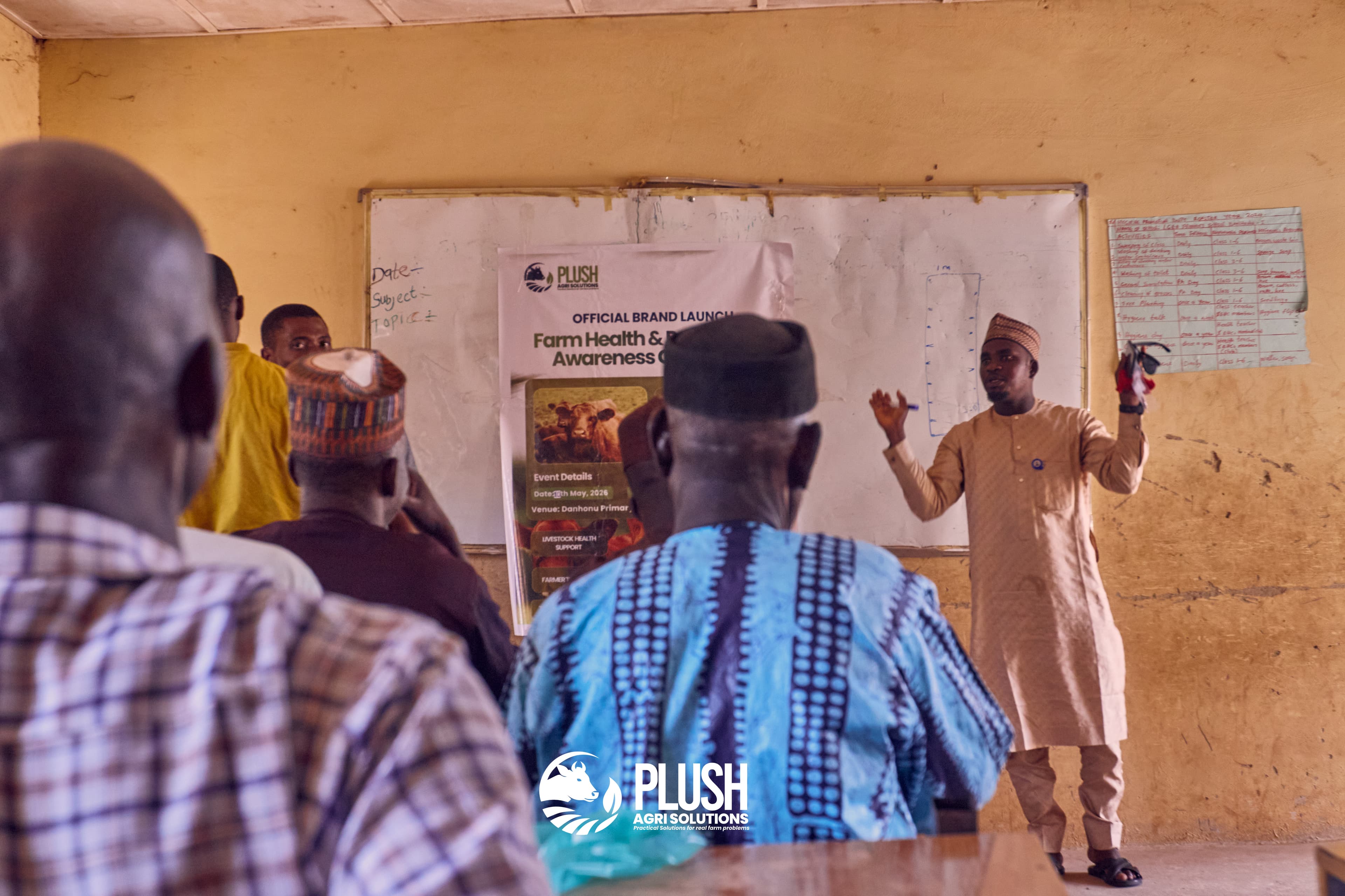 Plush Agri Solutions field officer presenting programme documentation at the official Farm Health and Biosecurity Awareness Campaign launch in Danhonu 1
